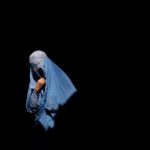 A burqa-clad Afghan woman walks in an old bazaar in Kabul. REUTERS/Ahmad Masood (AFGHANISTAN)