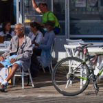 In Brooklyn, N.Y., a cafe on the Coney Island boardwalk draws people of all ages, soaking up the sun in the pandemic, October 2020. Ageism, a new study finds, is “prevalent, ubiquitous and insidious” and not getting enough global attention. JOHN PENNEY
