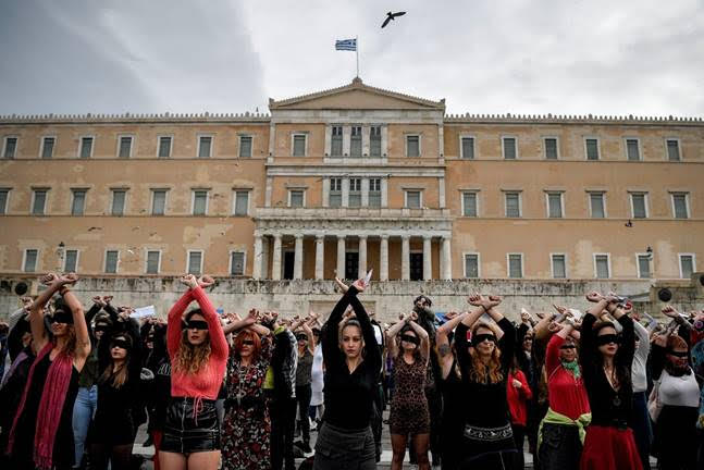 Activists in Athens perform choreography on Dec. 22 inspired by the Chilean feminist group Las Tesis to protest violence against women. (Louisa Gouliamaki/AFP/Getty Images)