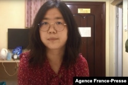 FILE - This screengrab taken on Dec. 28, 2020, from an undated video showing former Chinese lawyer and citizen journalist Zhang Zhan as she broadcasts via YouTube, at an unconfirmed location in China. (AFP / YouTube)