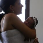 A mother cradles her baby in Santiago de Cuba. © Joe Raedle/Getty Images