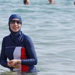 Karima, wearing a full-body burkini swimsuit, swims in Cannes after the call to support the wearing of burkinis by businessman and political activist Rachid Nekkaz. - Copyright ERIC GAILLARD/REUTERS