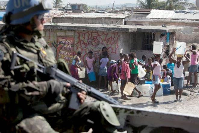 A soldier of the United Nations peacekeeping mission formerly deployed in Haiti, known as Minustah, patrolling in Port-au-Prince in 2010. Credit...Damon Winter/The New York Times