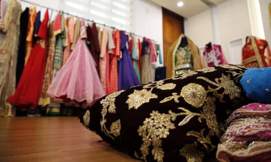 Secondhand clothes and wedding fabric are stored at Sabitha’s home in Kannuar, Kerala. They will be given free of charge to women for their weddings. Photograph: Sivaram V/The Guardian