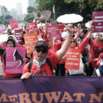 Women from all walks of life taking to the streets during the 'Perempuan Meruwat Negeri' (Women Heal the Nation) rally in Central Jakarta on Sunday (Dec 22). The rally was held to reclaim Dec 22 as women's awakening day instead of Mother's Day as declared by first president Soekarno. - Jakarta Post/ANN