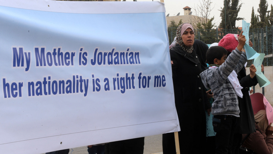 Jordanian women and their children protest for the right of mothers passing on their nationality to their children to mark International Women's Day in 2014 in Amman, Jordan. [Getty]