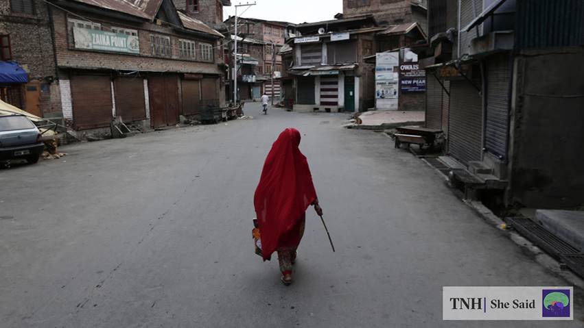 A woman walks through a deserted lane in August 2019, after India’s government moved to strip Kashmir’s semi-autonomous status and imposed a military lockdown. (Adnan Abidi/REUTERS)