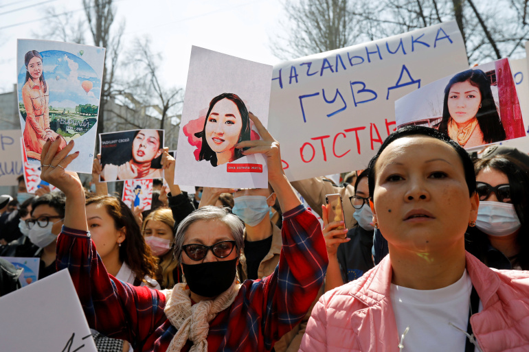 People attend a rally in front of Kyrgyzstan's interior ministry demanding the resignation of its leadership after the murder of kidnapped bride Aizada Kanatbekova amid alleged lack of action by the police, in Bishkek, Kyrgyzstan April 8, 2021. REUTERS/Vladimir Pirogov