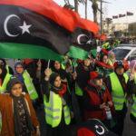 Women wave national flags and chant slogans during an April demonstration against Khalifa Haftar in Martyrs Square, in the LIbyan capital Tripoli. Photograph: Mahmud Turkia/AFP/Getty Images