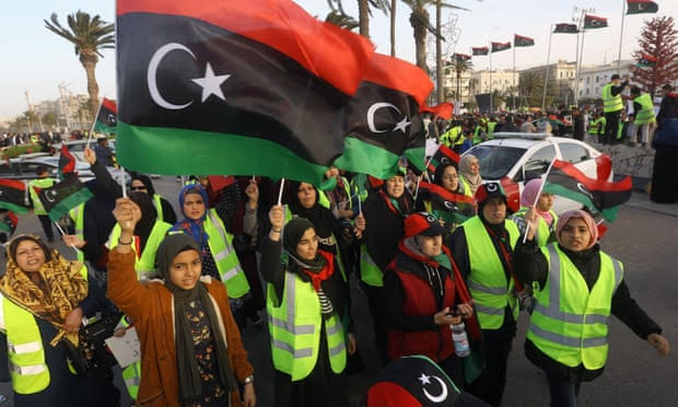 Women wave national flags and chant slogans during an April demonstration against Khalifa Haftar in Martyrs Square, in the LIbyan capital Tripoli. Photograph: Mahmud Turkia/AFP/Getty Images