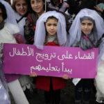 Children dressed as brides take part in a Beirut protest against underage marriage