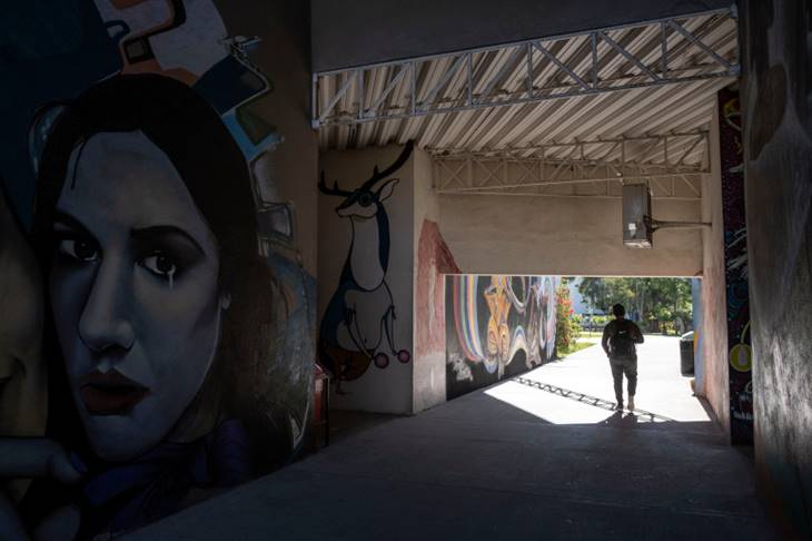 A student walks through the Universidad Autonoma de Baja California in Tijuana, Mexico, on March 9 during a day of national strike to denounce gender violence and the increasing toll of femicide. GUILLERMO ARIAS/AFP VIA GETTY IMAGES