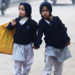 Two girls walk to school in Peshawar, NW Pakistan..