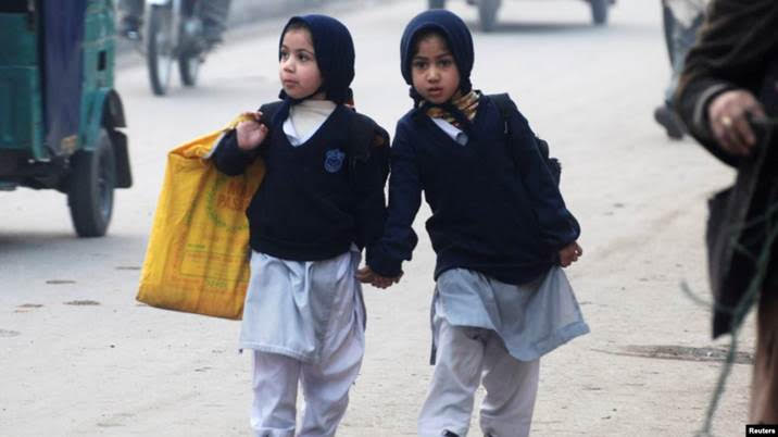 Two girls walk to school in Peshawar, NW Pakistan..