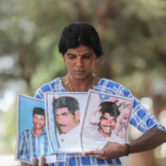 RANJANIDEVI HOLDS PHOTOS OF HER HUSBAND (MIDDLE) AND HER TWO BROTHERS WHO WENT MISSING DURING THE CIVIL WAR.