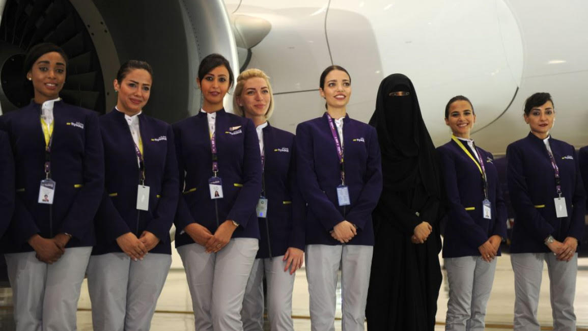 Hostesses of the Saudi Flyadeal company pose during the launching ceremony. [AMER HILABI/AFP via Getty]