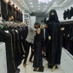 A Sri Lankan vendor shows a full face veil, called a niqab, at a shop selling clothes for Muslim women in Colombo on April 30, 2019. Religious tensions and a government ban on covering the face since the Easter Sunday suicide attacks have forced conservative Muslim women in Sri Lanka to shun veils, head scarves and long robes.