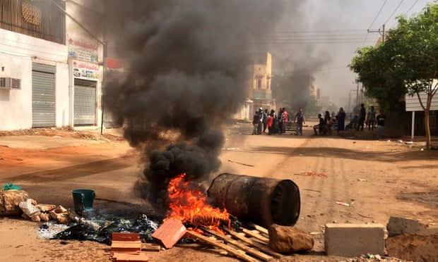 Demonstrators block a main road in Khartoum, the capital of Sudan, during a general strike. Photograph: Anadolu Agency/Getty Images