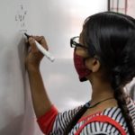 © UNICEF/Mithila Jariwala - A 13-year-old girl solves a maths sum at a school in Gujarat, India.