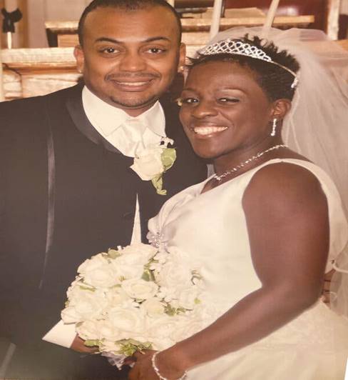 Sandra McGowan-Watts and her husband, Steven, at their wedding in 2007. He died of the virus in May.