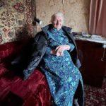 Halyna Vasylivna, 94, in her tiny ‘Khrushchevka’ flat in Kyiv’s Podil district, where she lives alone. Photograph: Courtesy of Akas